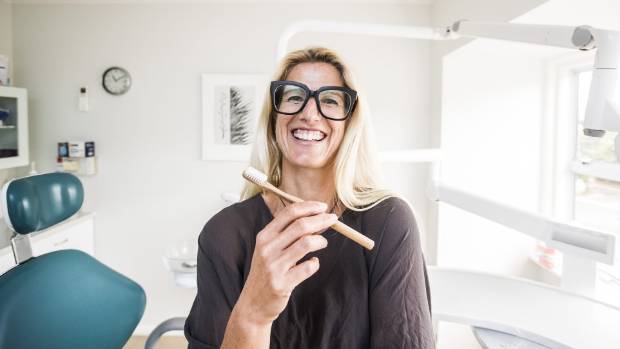 Dentist Nicky Francis of Do Gooder with an eco friendly toothbrush.